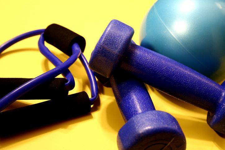 exercise-equipment-including-a-turquoise-rubber-ball-725x483